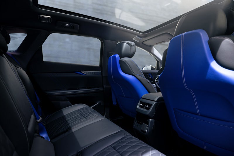 Back Seat View of the 2026 OPTIQ-V Blue Front Seats, Sun Roof, and Interior | McDonald Cadillac in Saginaw MI